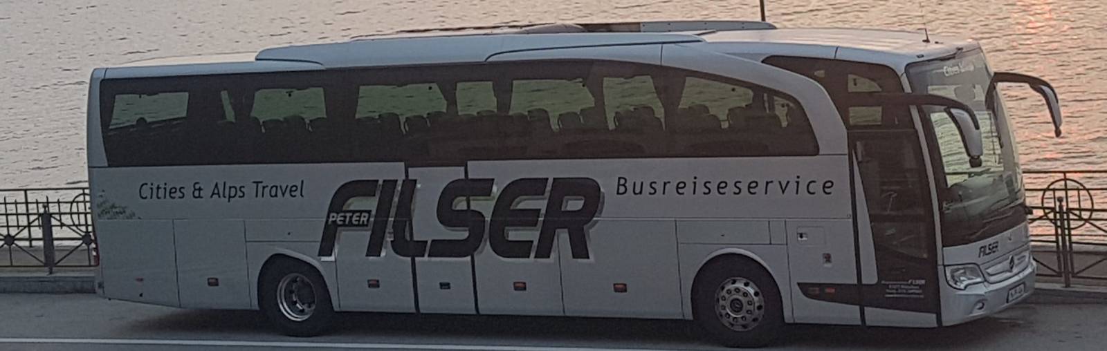 Busreisen Filser coach on a lakeshore