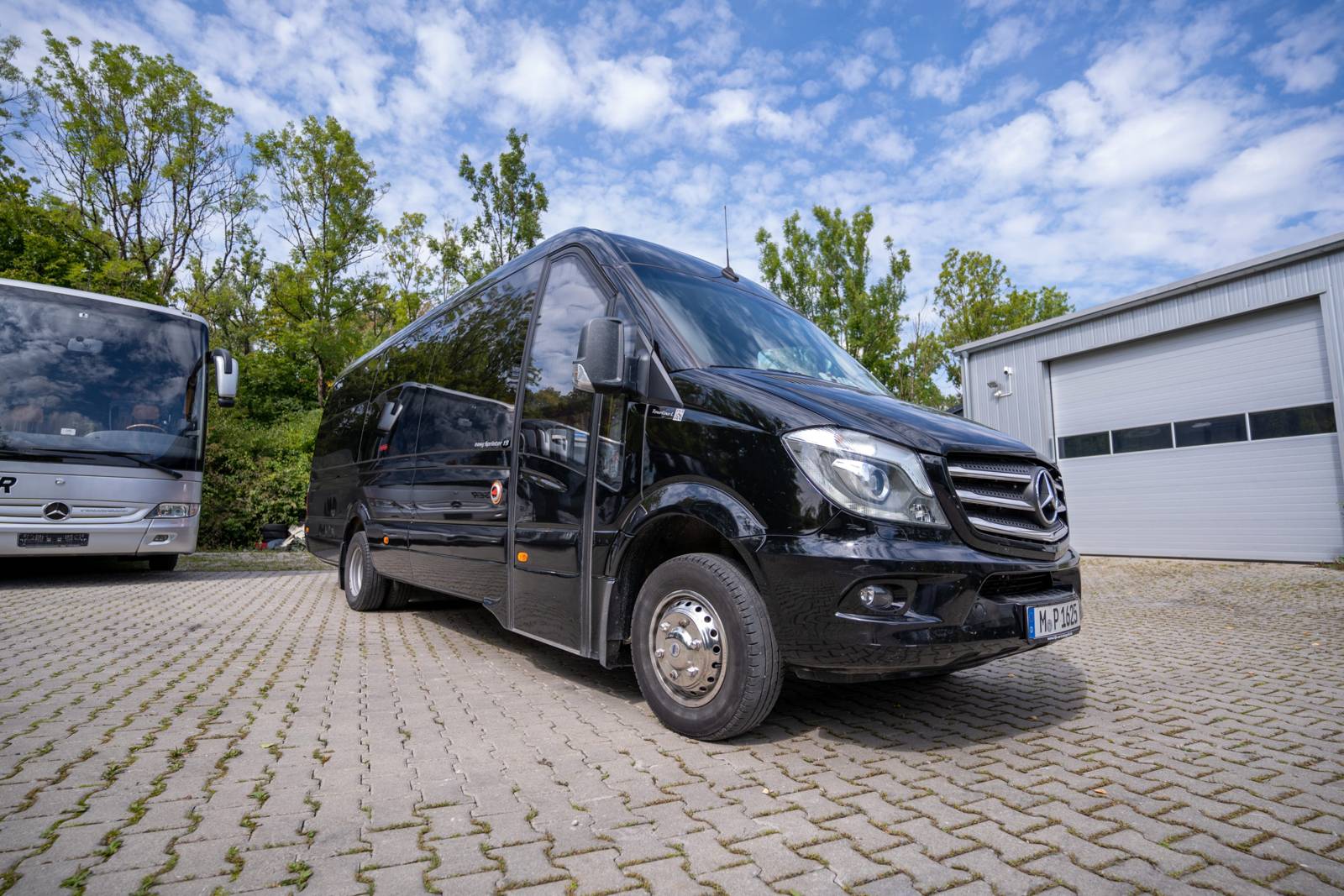 Black Mercedes Sprinter minibus