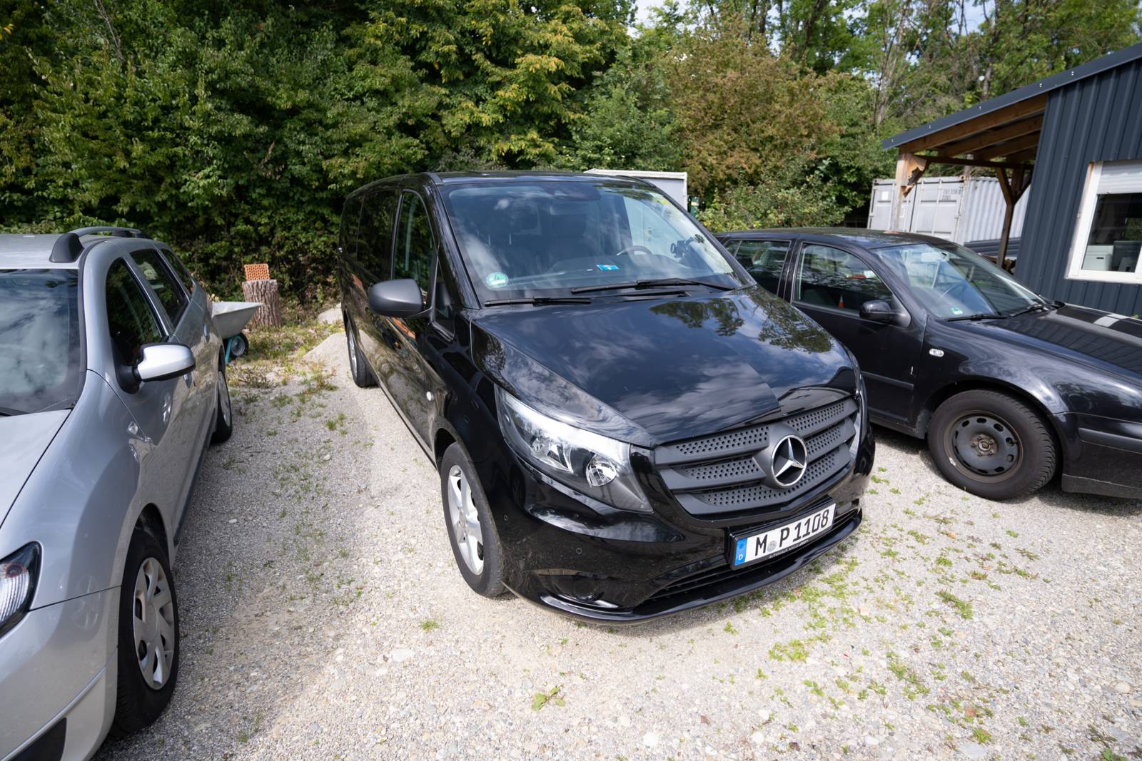 Black Mercedes limousine and van